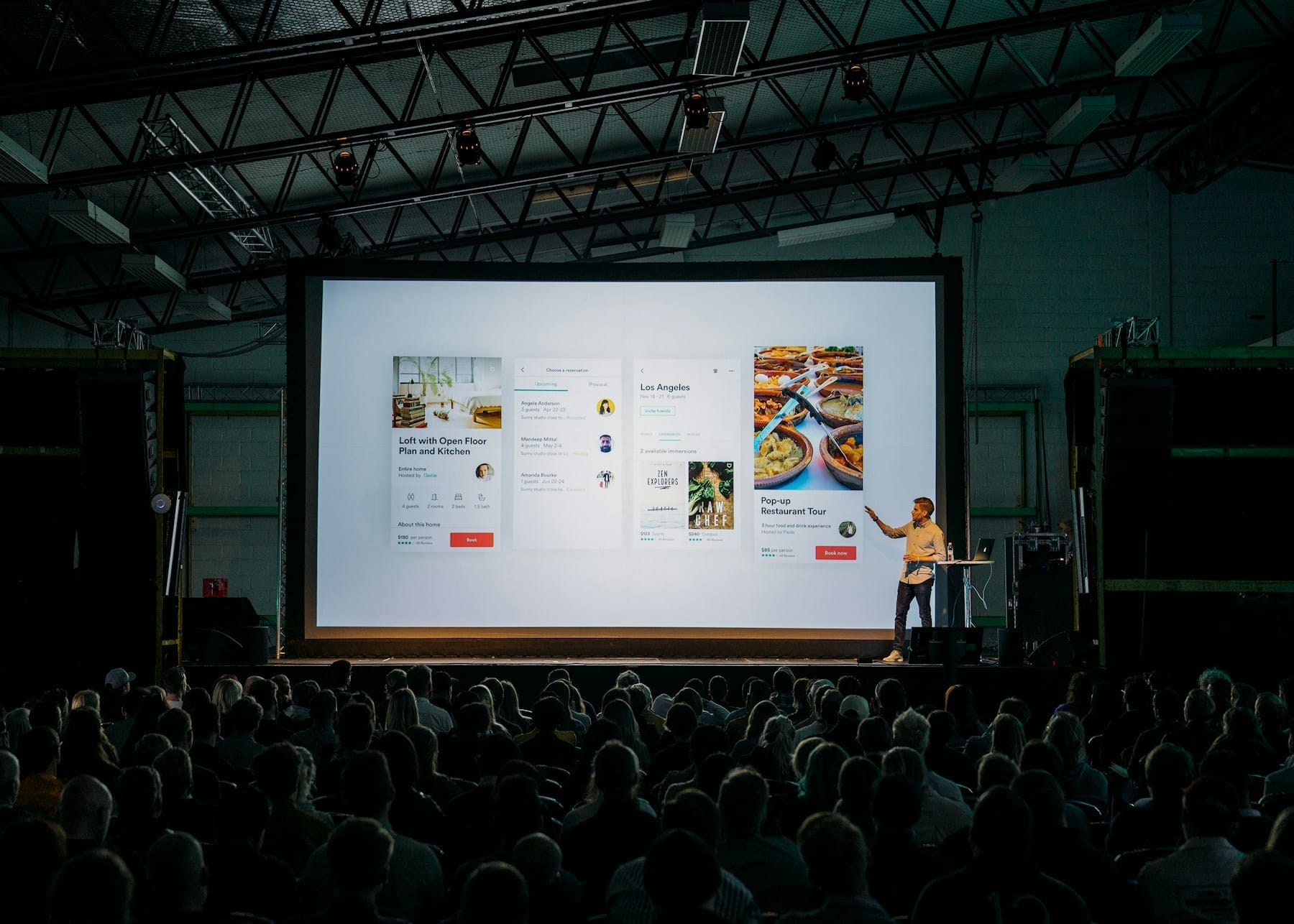 Speaker on a warmly lit event stage