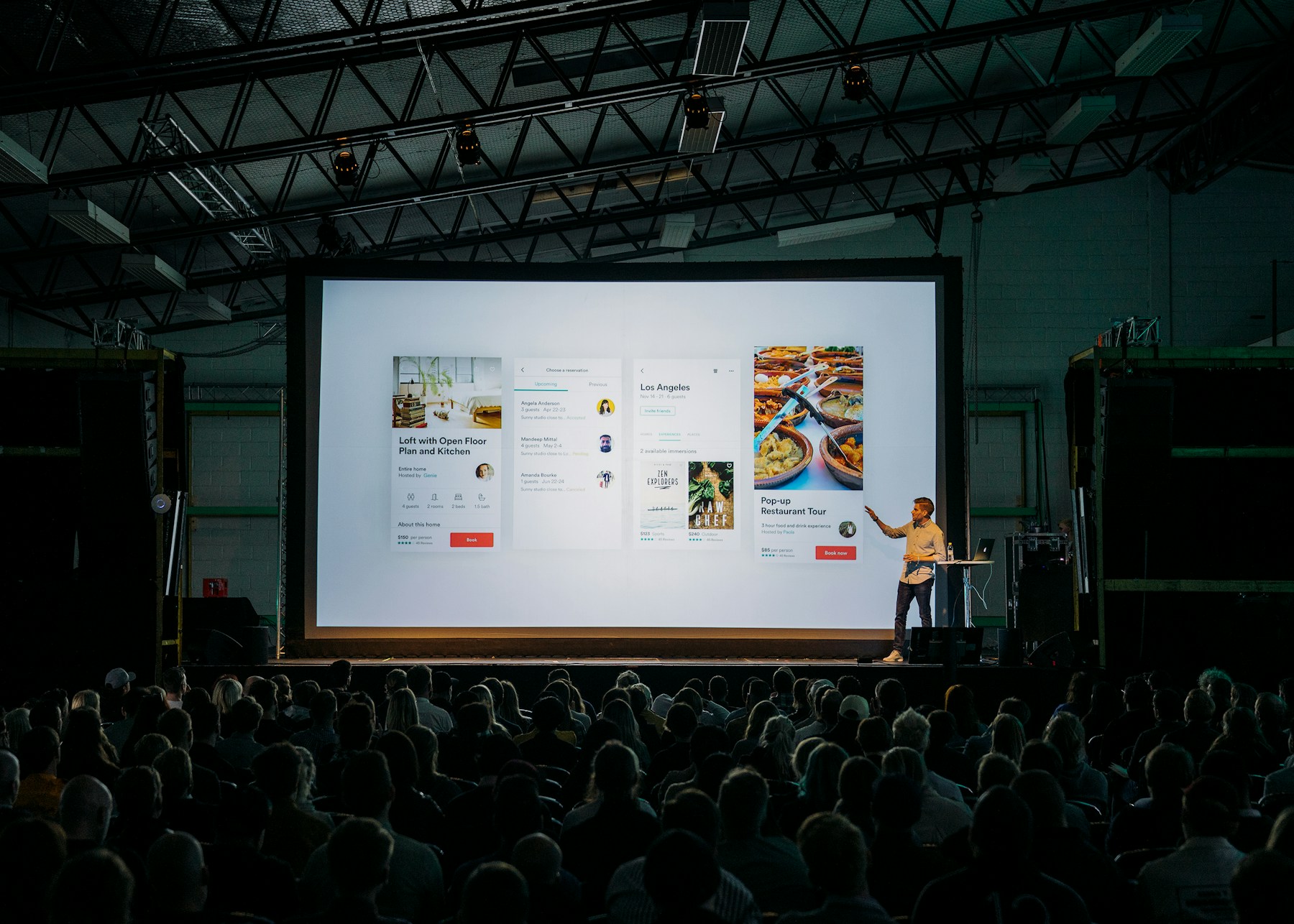 Speaker on a warmly lit event stage